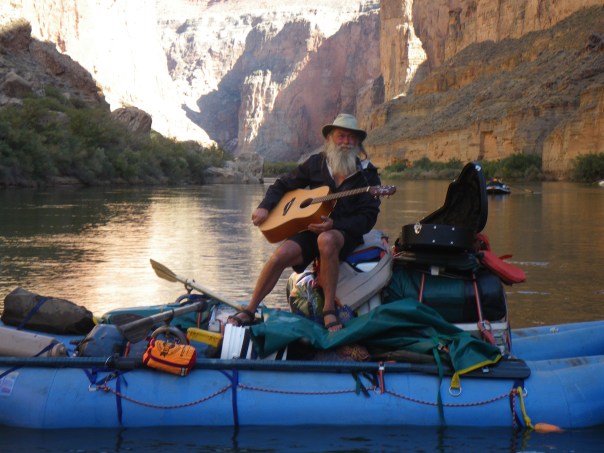 Playing guitar on the river